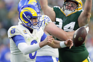 Rams quarterback Matthew Stafford (9) fumbles the ball under pressure by Packers defensive end Dean Lowry (94) during the first quarter at Lambeau Field in Green Bay, Wis., Sunday, Nov. 28, 2021.