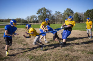 The Riverside football team practices hip drive and tackling technique during practice Tuesday, Oct. 16, 2018, in Cedar Rapids.