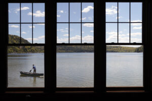 A boater paddles his canoe standing up, along the north end of Devil’s Lake in Baraboo, Wis., Wednesday, May 12, 2021. 
