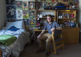 Kai Rowlands, 19, poses for a portrait in his dorm room at Marquette University in Milwaukee, Wis., Sunday, Oct. 23, 2022. Rowlands is an undergraduate student studying physics and Spanish.